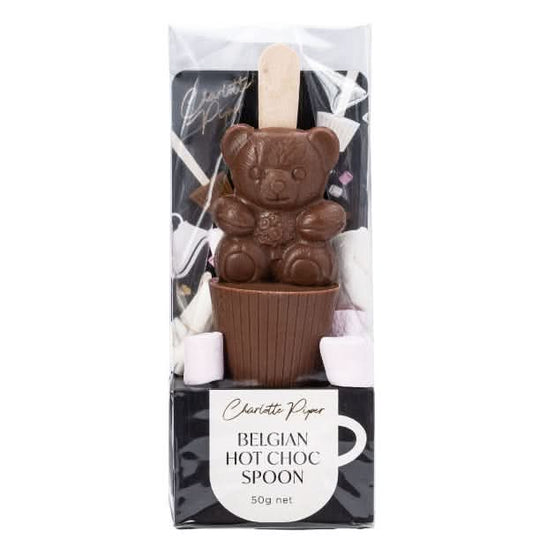 Chocolate spoon shaped like a bear in a packaging box with 'Charlotte Piper' branding.